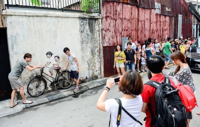 tourists penang street art